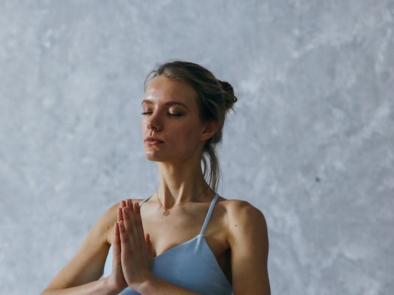 A person holding a challenging balance pose in yoga.